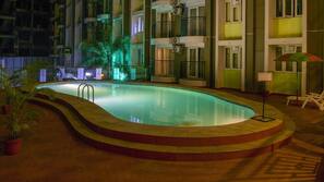 Indoor pool, open 7 AM to 7 PM, pool umbrellas