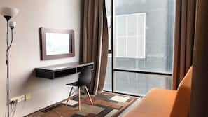 Desk, iron/ironing board, linens