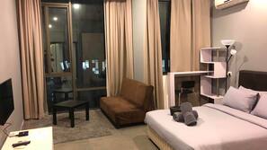Desk, iron/ironing board, linens