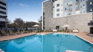 Outdoor pool, open 10:00 AM to 10:00 PM, pool loungers