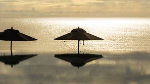 On the beach, sun-loungers, beach umbrellas, beach towels