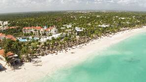 Private beach, white sand, sun loungers, beach umbrellas