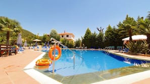 Seasonal outdoor pool, pool loungers