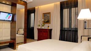 Ropa de cama de alta calidad, minibar, caja fuerte y escritorio