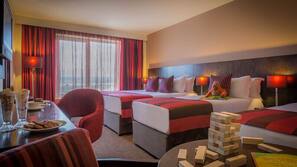Hypo-allergenic bedding, desk, laptop workspace, blackout drapes