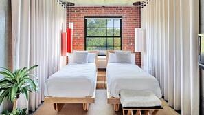 Hypo-allergenic bedding, down comforters, pillowtop beds, in-room safe
