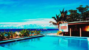 Outdoor pool, pool umbrellas, pool loungers