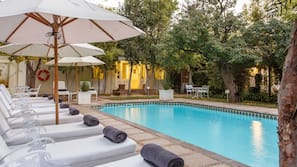 Outdoor pool, open 6 AM to 11 PM, pool umbrellas, sun loungers