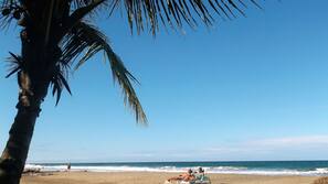 On the beach, sun loungers, beach umbrellas, beach towels