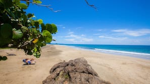 On the beach, sun loungers, beach umbrellas, beach towels