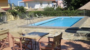 Seasonal outdoor pool, pool umbrellas, sun loungers
