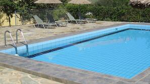 Seasonal outdoor pool, pool umbrellas, sun loungers