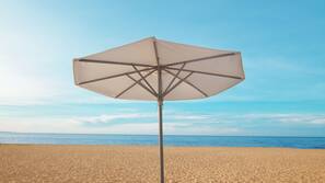 Private beach, white sand, sun loungers, beach umbrellas