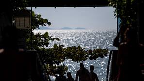 On the beach, white sand, sun-loungers, beach umbrellas
