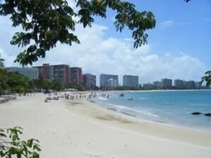 On the beach, white sand, beach towels