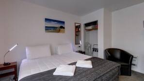 Blackout curtains, iron/ironing board, free WiFi, linens