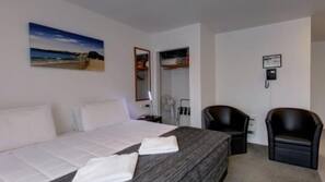 Blackout curtains, iron/ironing board, free WiFi, linens