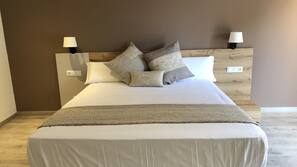Desk, blackout curtains, free cots/infant beds, free WiFi