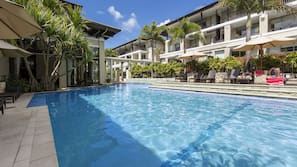 Outdoor pool, pool umbrellas, sun loungers
