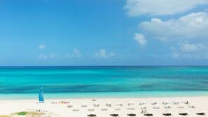 On the beach, beach cabanas, sun-loungers, beach umbrellas