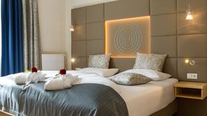 Luxe beddengoed, een kluis op de kamer, een bureau