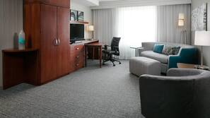 Premium bedding, desk, laptop workspace, blackout drapes