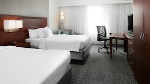 Premium bedding, desk, laptop workspace, blackout drapes