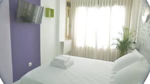 Edredones de plumas, minibar, escritorio y sistema de insonorización