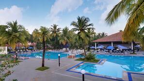 Outdoor pool, open 7 AM to 7 PM, pool umbrellas, pool loungers