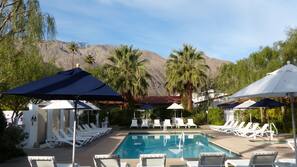 Outdoor pool, open 8 AM to midnight, pool umbrellas