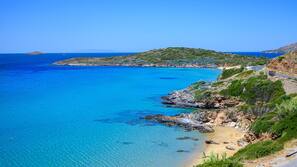 On the beach, sun loungers, beach umbrellas, beach towels