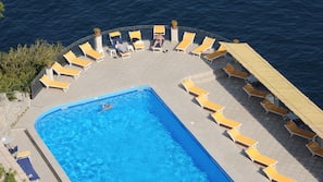 Outdoor pool, open 8:00 AM to 6:30 PM, pool umbrellas, sun loungers