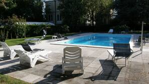 Seasonal outdoor pool, open 8:00 AM to 7:00 PM, pool umbrellas