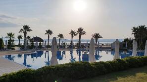 Indoor pool, seasonal outdoor pool, pool umbrellas, sun loungers