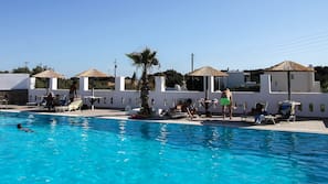 Outdoor pool, pool umbrellas, sun loungers