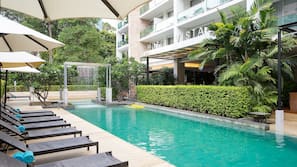 Outdoor pool, pool umbrellas, sun loungers