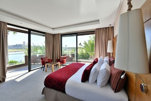 Premium Suite (River View) | Minibar, in-room safe, individually decorated, individually furnished
