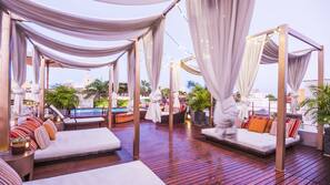 Indoor pool, outdoor pool, pool umbrellas, sun loungers