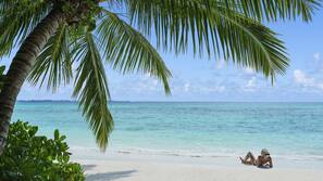 Private beach, white sand, sun-loungers, beach umbrellas