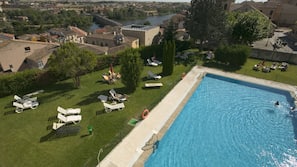 Seasonal outdoor pool, open 11:30 AM to 8:30 PM, pool umbrellas