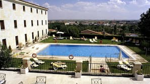 Seasonal outdoor pool, open 11:30 AM to 8:30 PM, pool umbrellas