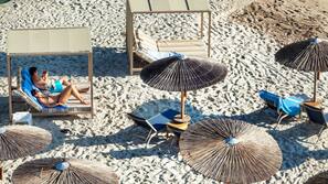 On the beach, sun-loungers, beach umbrellas, scuba diving