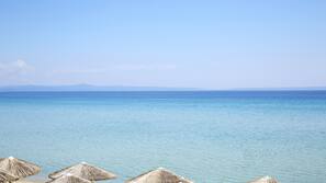On the beach, sun-loungers, beach umbrellas, scuba diving