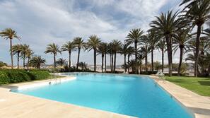Outdoor pool, pool umbrellas, pool loungers
