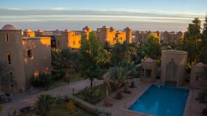 2 outdoor pools, open 7 AM to 9 PM, pool umbrellas, pool loungers
