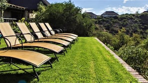 2 outdoor pools, pool umbrellas, pool loungers