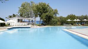 Seasonal outdoor pool, pool umbrellas, pool loungers