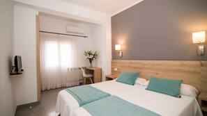 Caja fuerte, escritorio, wifi gratis y ropa de cama