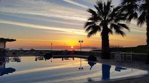 Seasonal outdoor pool, pool umbrellas, sun loungers