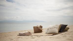 On the beach, sun-loungers, beach umbrellas, beach towels